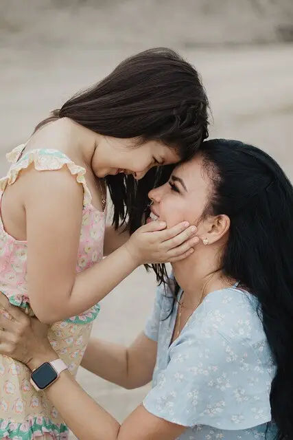 Woman and child looking into each other's eyes. Connection is Key.