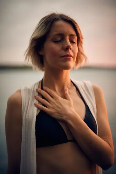 Woman with hand on heart. Trust Yourself First