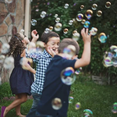 Kids playing with bubbles. Play Full Out